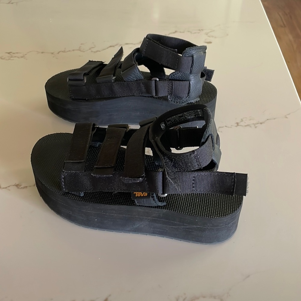 Excellent condition, worn slightly. Black strappy Tevas women’s size 7.